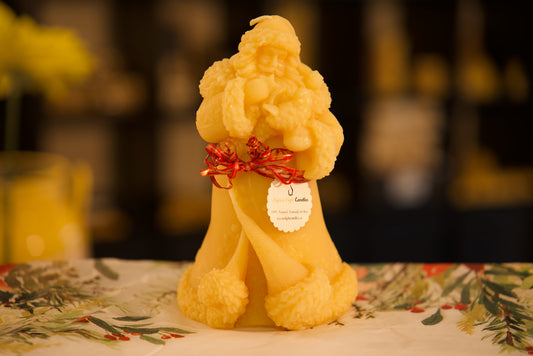 Charming pure beeswax Santa Claus candle with bird detail, festive holiday decor, 4x8 inches