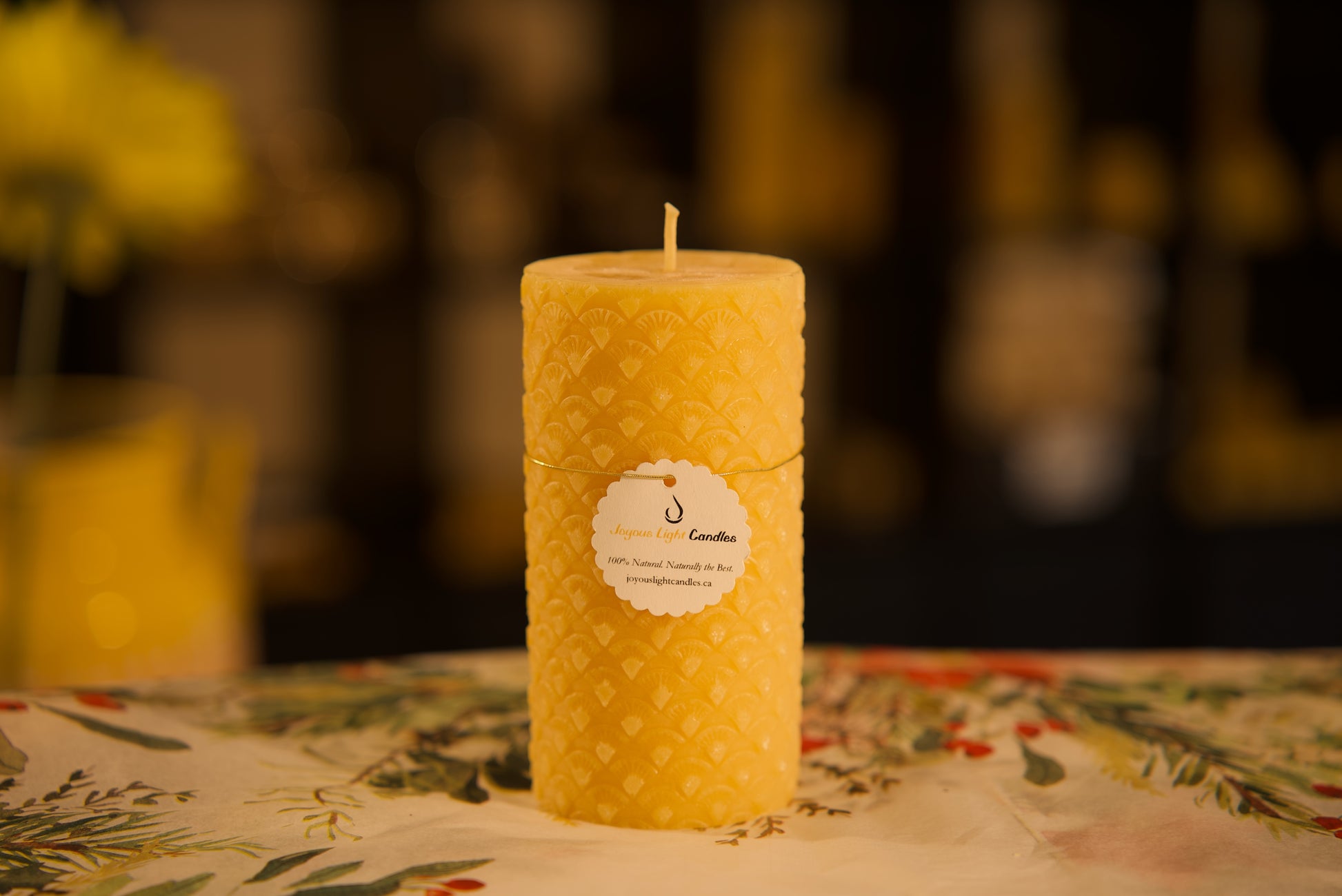 Decorative pure beeswax pillar with delicate fan pattern, vintage-inspired design, 2.5x5.125 inches