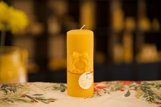 Festive pure beeswax pillar with wreath design, seasonal natural decor, 2.25x5.25 inches